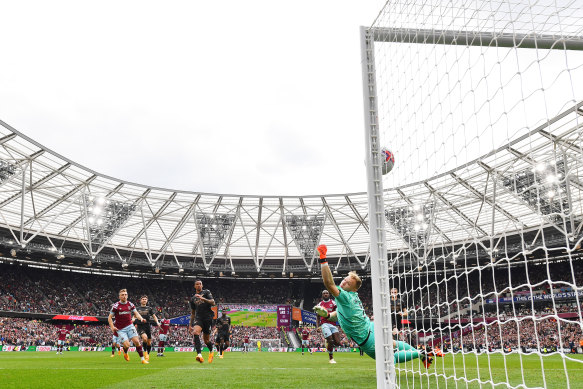 Jarrod Bowen beats Arsenal goalkeeper Aaron Ramsdale to score for West Ham.