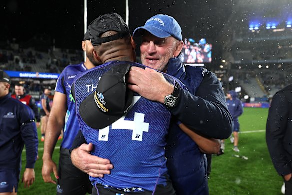 Vern Cotter celebrates winning the Super Rugby Pacific title with the Blues.