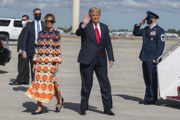 Melania Trump emerged from Air Force One in a Gucci dress, a bright contrast to her all-black departure ensemble.