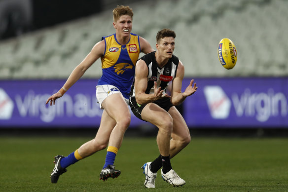 Brody Mihocek marks during the Magpies’ convincing win.