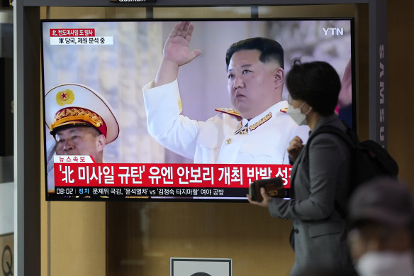 A TV screen showing a news program reporting about North Korea’s missile launch with file footage of North Korean leader Kim Jong Un, is seen at the Seoul Railway Station in Seoul.