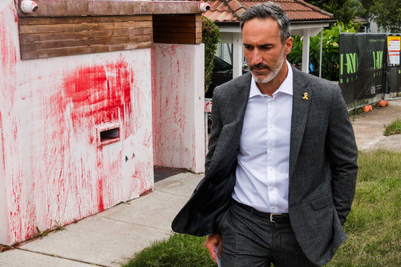Alex Ryvchin visiting his former home, vandalised with an antisemitic message, in January.
