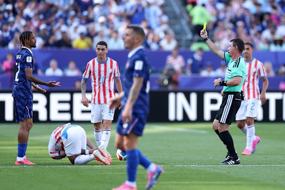 Bradley Barcola receives a yellow card.