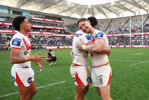 Zac Lomax (right) and Dragons teammates celebrate their come-from-behind win on Sunday.