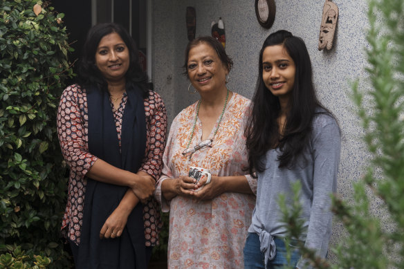 Priya Pillai, Devleena Ghosh and Dola Baswas outside their home.