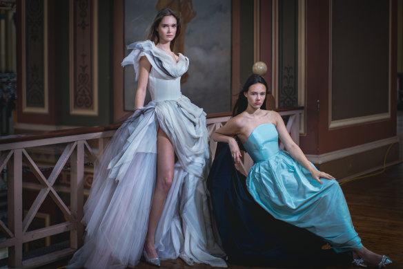 Melbourne couturier Sonia Cappellazzo’s grey tulle gown (modelled by Charley Wakelin) and a strapless Van Der Kooij dress (modelled by Ursula Wlazlo) at the Royal Exhibition Building.