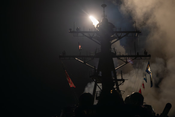 The guided-missile destroyer USS Gravely launches Tomahawk missiles in response to Houthi attacks.