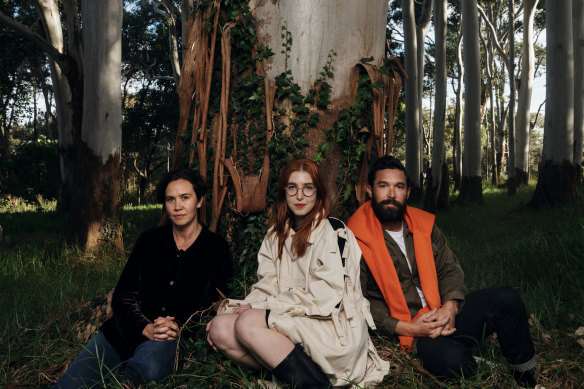 New works were created by artists (from left) Yasmin Smith, Anna May Kirk and Dean Cross, pictured here at the base of a eucalyptus tree in Centennial Parklands.