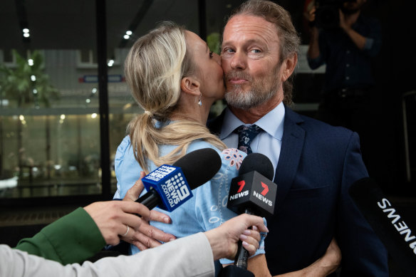 Craig McLachlan is kissed by his partner, Vanessa Scammell, after the verdicts.