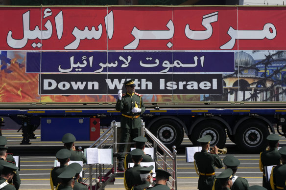An anti-Israel banner is carried on a truck in an annual military parade in September in front of the shrine of the late revolutionary founder Ayatollah Khomeini, just outside Tehran, Iran.