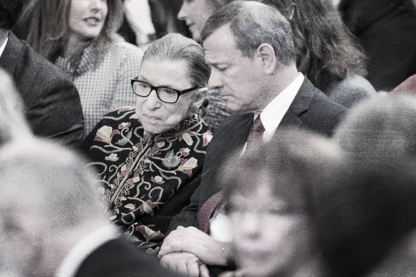 Ruth Bader Ginsburg chats with John Roberts, the Chief Justice of the Supreme Court, before a ceremony at the White House in 2018. 