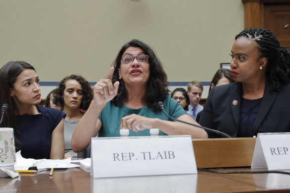 Rashida Tlaib, center, alongside fellow Democrats Alexandria Ocasio-Cortez and Ayanna Pressley.