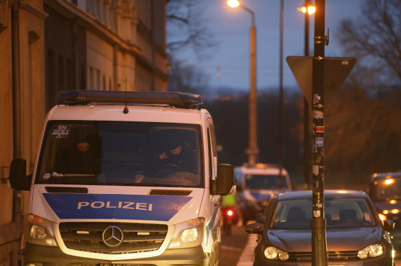 A police car is seen in the Pieschen district during a raid after threats against Saxony’s Prime Minister Kretschmer, in Dresden, Germany.