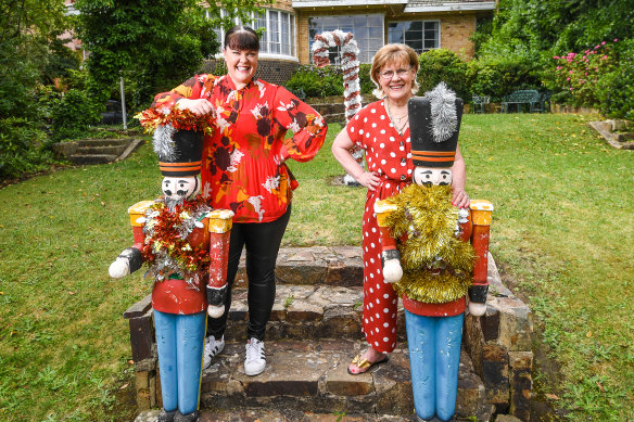 Longtime Ivanhoe resident Jennifer Bell, right, with daughter Louise and festive friends, is disappointed The Boulevard Christmas lights have been called off this year. 