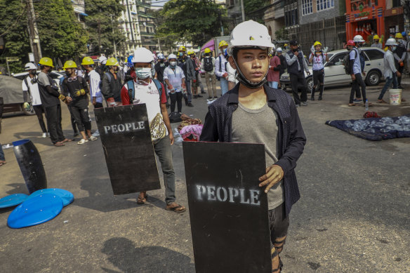 Anti-coup protesters with makeshift shields during a rally in Yangon, Myanmar on Wednesday.