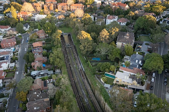 The abandoned station is surrounded by homes. 