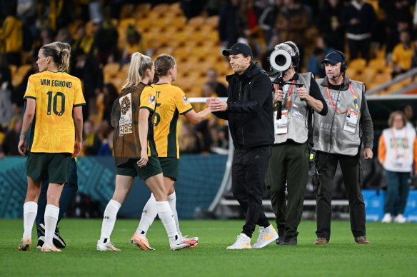 Australia coach Tony Gustavsson shakes hands with Clare Hunt after the match.