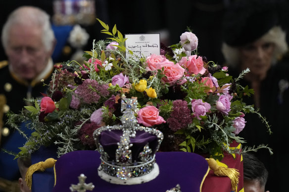 The crown, flowers and handwritten note from King Charles on the Queen’s coffin.