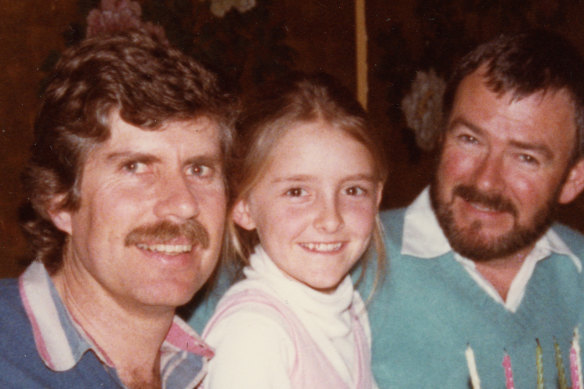 Katie Little with her two "uncles", Colin Brees, left, and Colin Johnston.