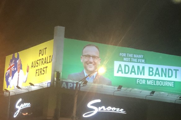 A strange pair of politicians peer down at voters in central Melbourne.