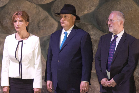Hungarian Prime Minister Viktor Orban centre, his wife Aniko Levai and Director of the Yad Vashem Libraries Dr Robert Rozett attend a memorial ceremony at the Yad Vashem Holocaust Memorial in Jerusalem.