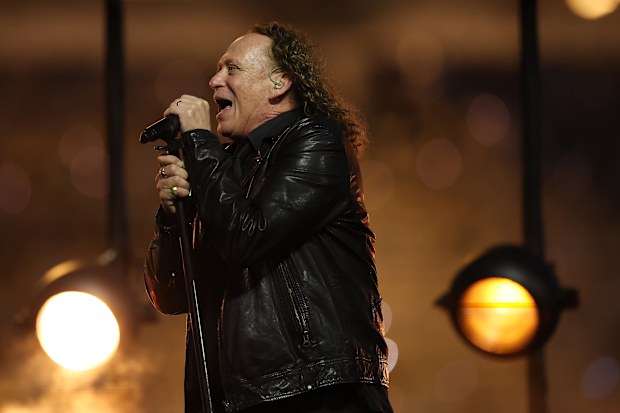 Dave Gleeson, lead singer of The Screaming Jets, performs at the grand final.