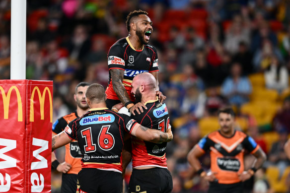 Hamiso Tabuai-Fidow celebrates the Mark Nicholls try for the Dolphins against Wests Tigers in Magic Round.