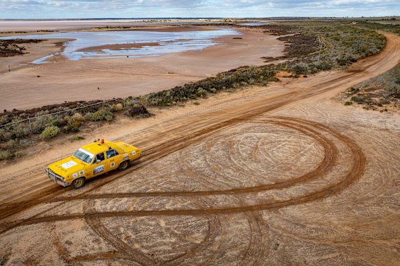 A trek car passes Lake Tyrrell in Victoria on The Outback Car Trek. 