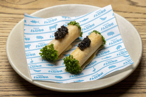 Feuille de brick, thin pastry tubes filled with whipped Brillat-Savarin cheese and topped with caviar.