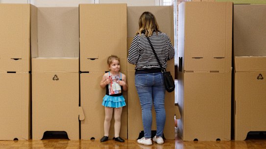 4 year old Elkie waits for her mum Megan Bradford to vote at Singleton Heights polling centre in the upper Hunter Valley town of Singleton. 2022 Federal Election. Saturday 21 May 2022. Pic by Max Mason-Hubers for SMH. NO BYLINE PLEASE .