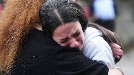 Mourners gather near the Heaton Park Hebrew Congregation Synagogue on Thursday after a terror attack killed two people and injured others.