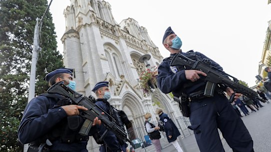 Police officers stand guard near Notre-Dame Cathedral in Nice.