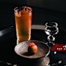 Sake cocktail with an ikura (salmon roe) doughnut.