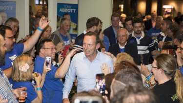 Supporters commiserate with Tony Abbott at Manly Leagues Club on election night. 
