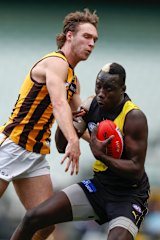Jack Scrimshaw and Mabior Chol battle for the ball
