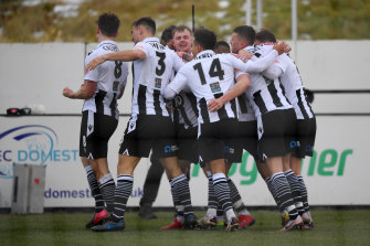 Mike Calveley celebrates with his Chorley teammates after scoring their second goal.