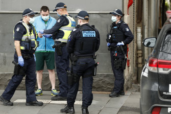 A man is issued a fine for breaching lockdown rules in Melbourne’s CBD.