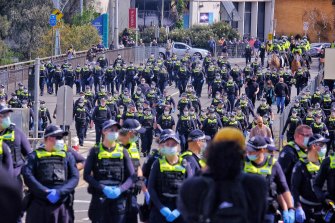 Police in Melbourne during an anti-lockdown protest on Saturday.