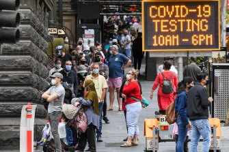 Huge queues formed early for coronavirus testing at the Melbourne Town Hall on Christmas Day. 