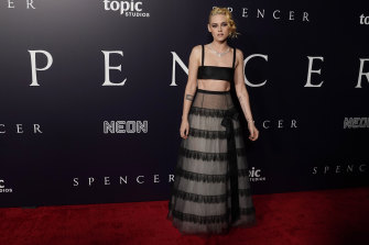Kristen Stewart in Chanel, the star of “Spencer,” poses at the premiere of the film at the Directors Guild of America.