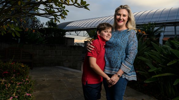Senator Hollie Hughes, with son Fred who has autism, said the independent assessment trialled uses a “tick-a-box algorithm”.
