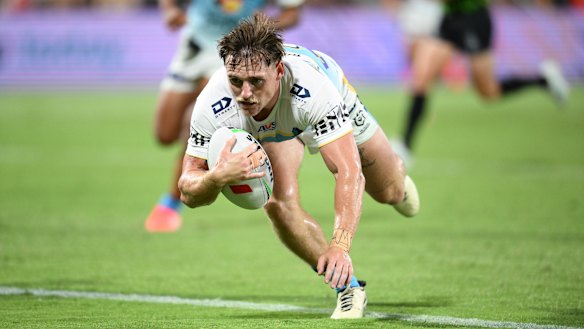AJ Brimson scores for the Gold Coast Titans against the Dolphins in the Preseason Challenge.