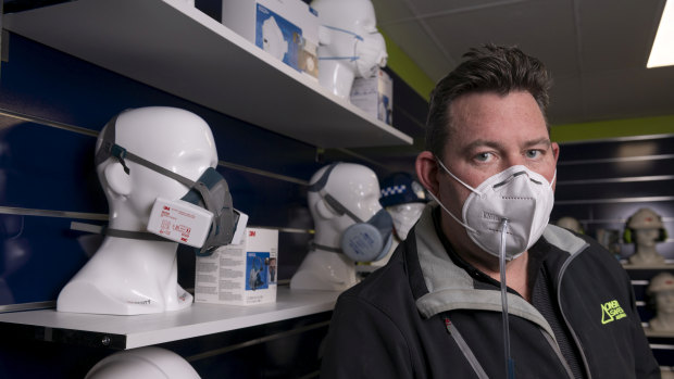 Director of Onsite Safety Australia, Chris Bellamy, demonstrating testing of a faulty face mask.