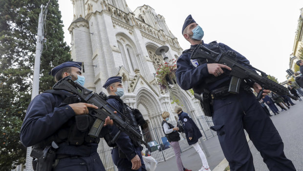 Police officers stand guard near Notre-Dame Basilica in Nice following the fatal attack in October.
