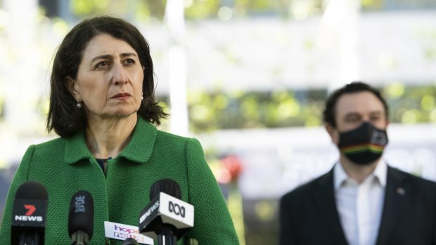 NSW Premier Gladys Berejiklian and Tourism Minister Stuart Ayres on Friday. Ayres expects Local Government Areas will no longer be used to mark boundaries of concern once a 70 per cent vaccination is achieved.