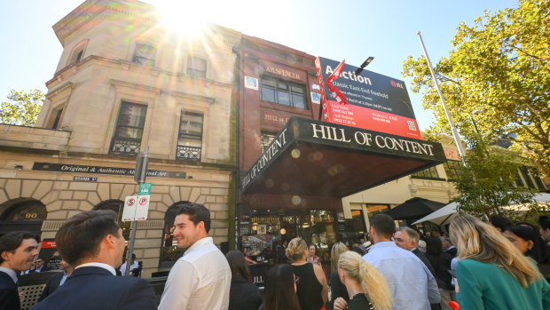 The crowd gathered outside the Hill of Content bookshop for Thursday’s auction.