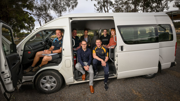 Teachers on the Wedderburn College school bus driven by assistant principal Dean Lockhart.