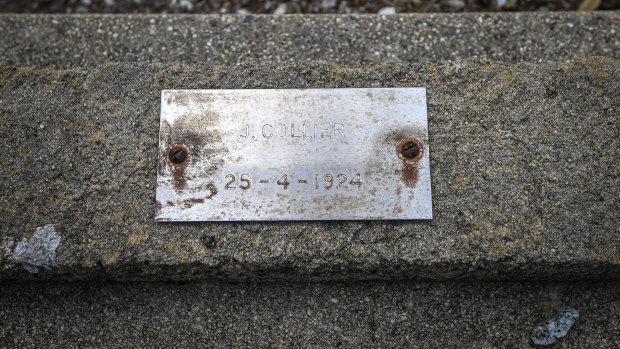 The grave of J. Collier, whose war memorial headstone was removed and replaced with a tin plaque.