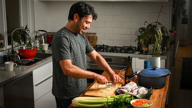 Benjamin Preiss preparing the rabbit he shot for stew.