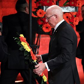 Governor-General David Hurley lays a wreath during the memorial in Jerusalem. 